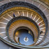 Students walking down the spiral steps at the Vatican Museums.